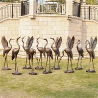 放古铜色玻璃钢仙鹤雕塑，承载祥瑞文化的景观小品