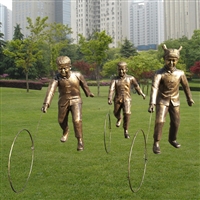 Sculpture of a child catching fish, playful sculpture