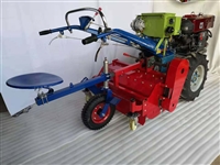 Two wheeled manual tractor with 25 horsepower electric start, manual trenching, rotary tillage, and ridging machine